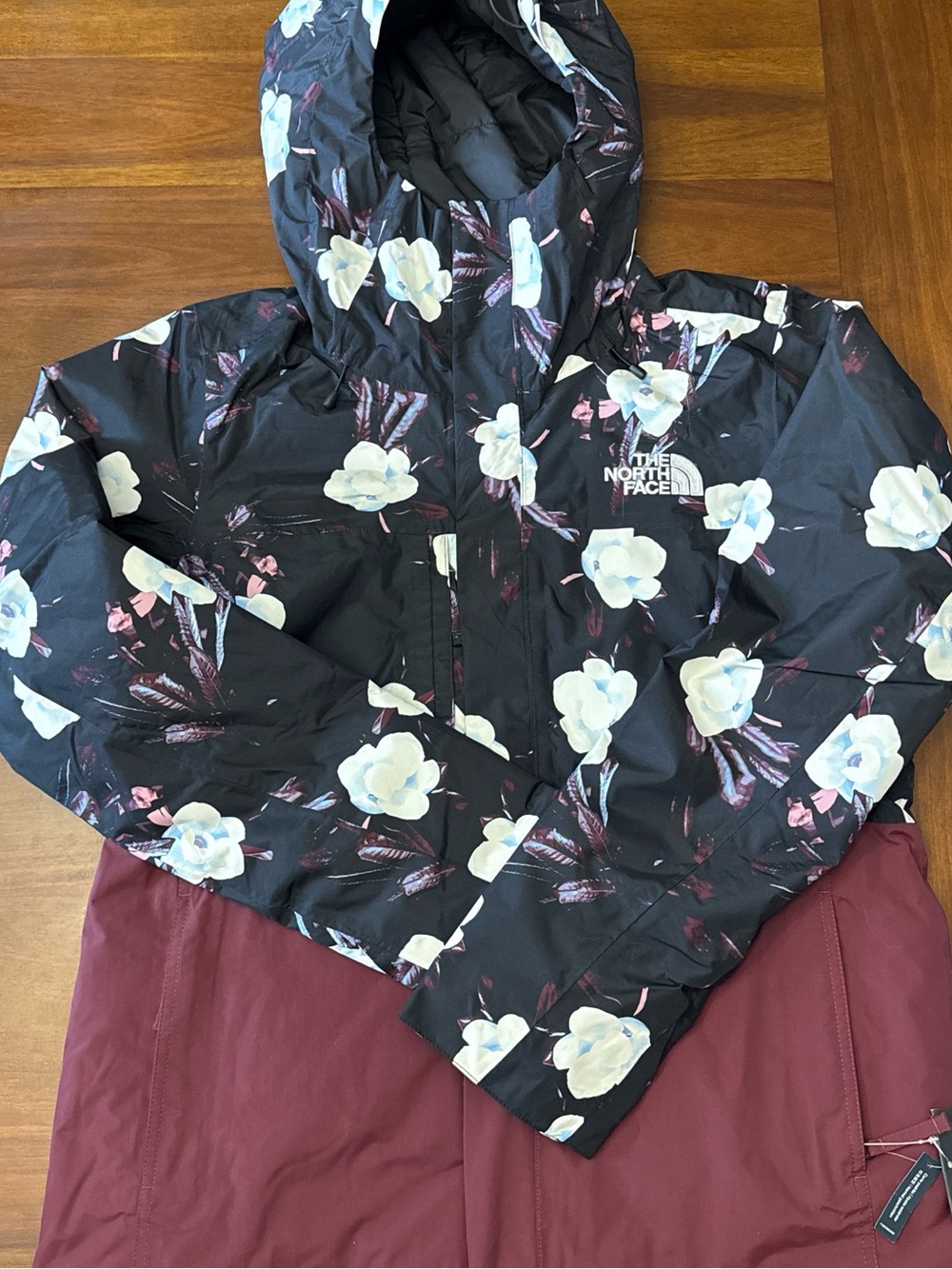 The North Face Black Floral Hooded Jacket with Burgundy Panel